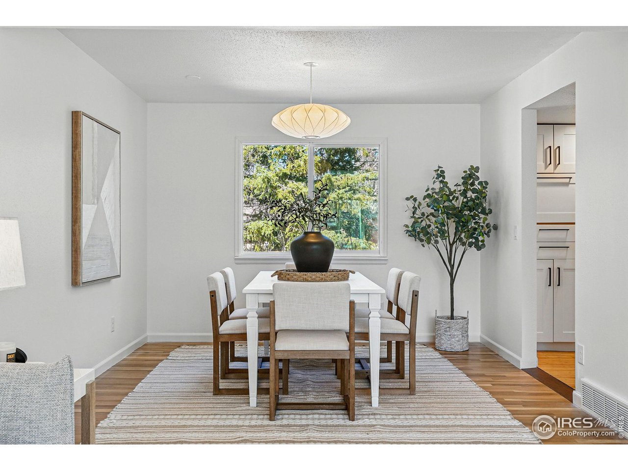 3495 Endicott Drive Boulder, CO 80305 - Photo 7 of 40 a view of a dining room with furniture and wooden floor