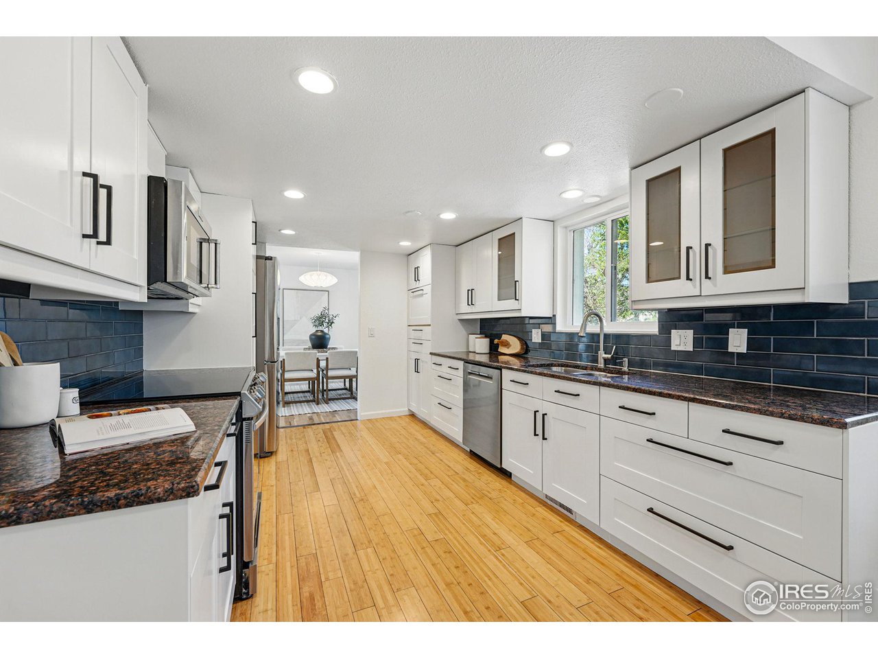 3495 Endicott Drive Boulder, CO 80305 - Photo 10 of 40 a large kitchen with stainless steel appliances granite countertop a stove a sink and a granite counter tops