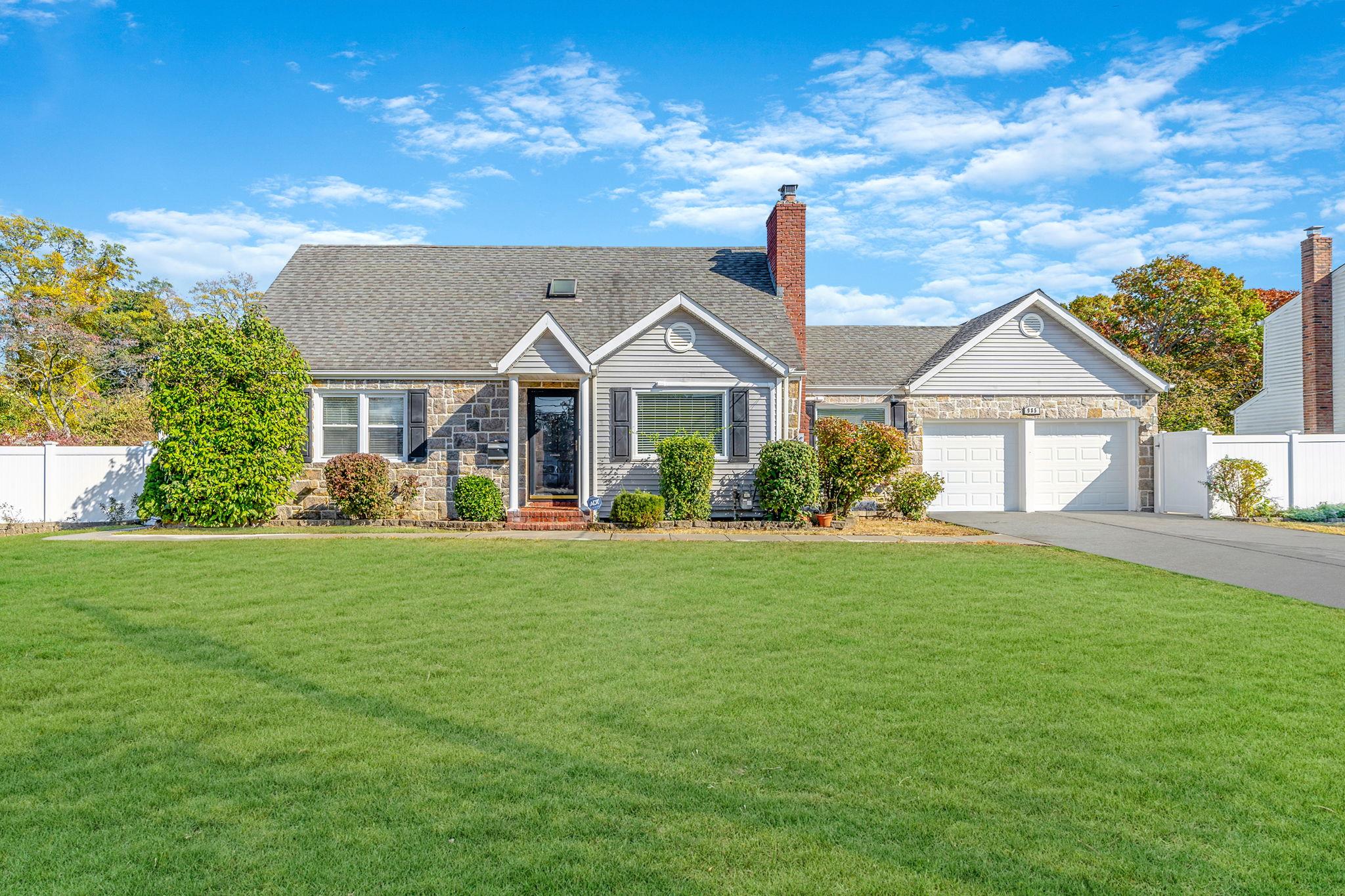 985 Merrick Avenue Merrick, NY 11566 - Photo 1 of 1 a front view of a house with garden