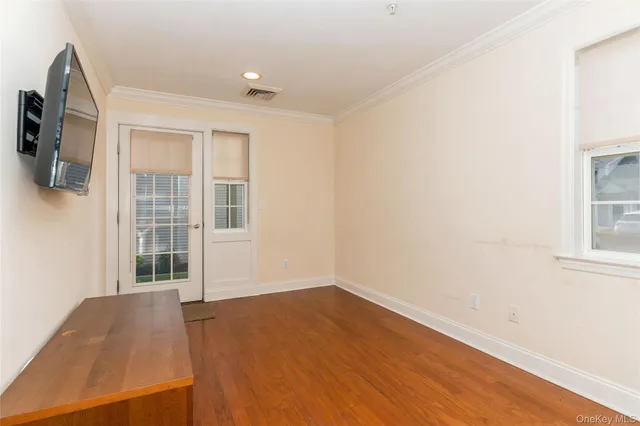 a kitchen with stainless steel appliances granite countertop wooden cabinets a stove and a sink