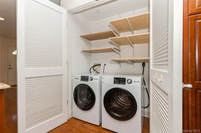 a bathroom with a toilet sink and shower