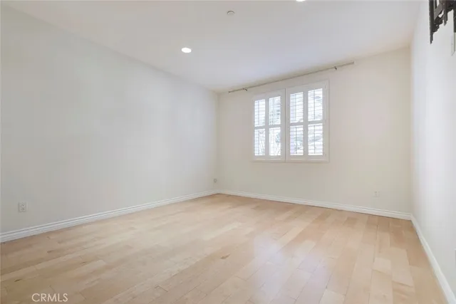 an empty room with a kitchen