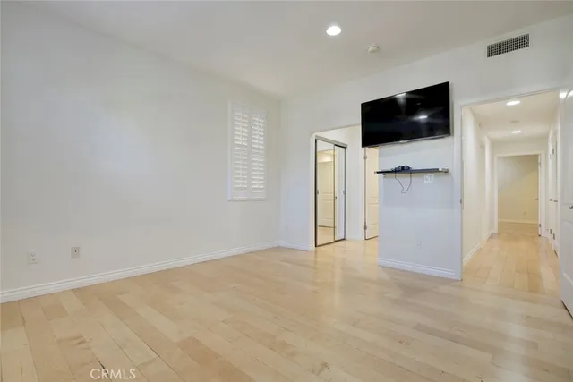 a view of a bathroom with a glass door and a bathroom