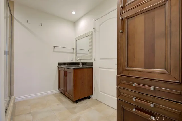 a bathroom with a glass shower door
