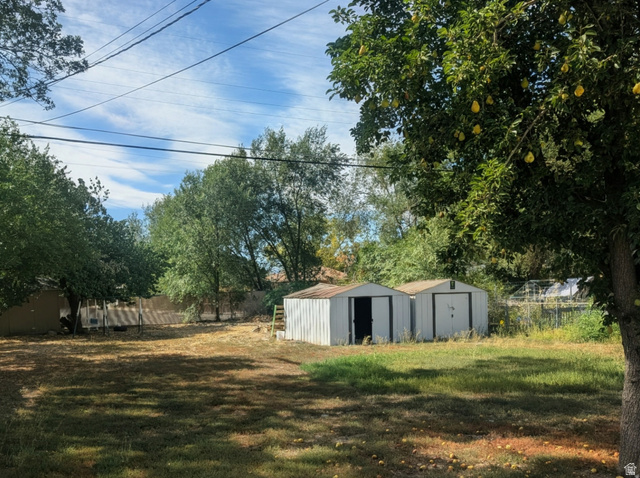 197 West Center Street Midvale, UT 84047 - Photo 2 of 12 View of yard featuring a storage unit