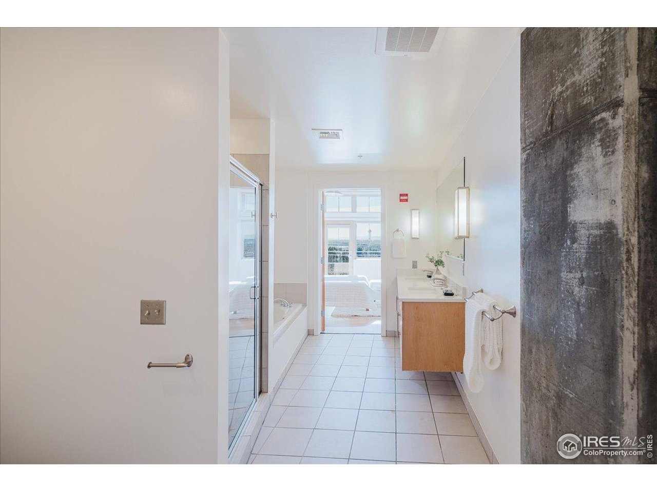 1925 West 32nd Avenue, Unit 401 Denver, CO 80211 - Photo 22 of 42 a bathroom with a glass door shower