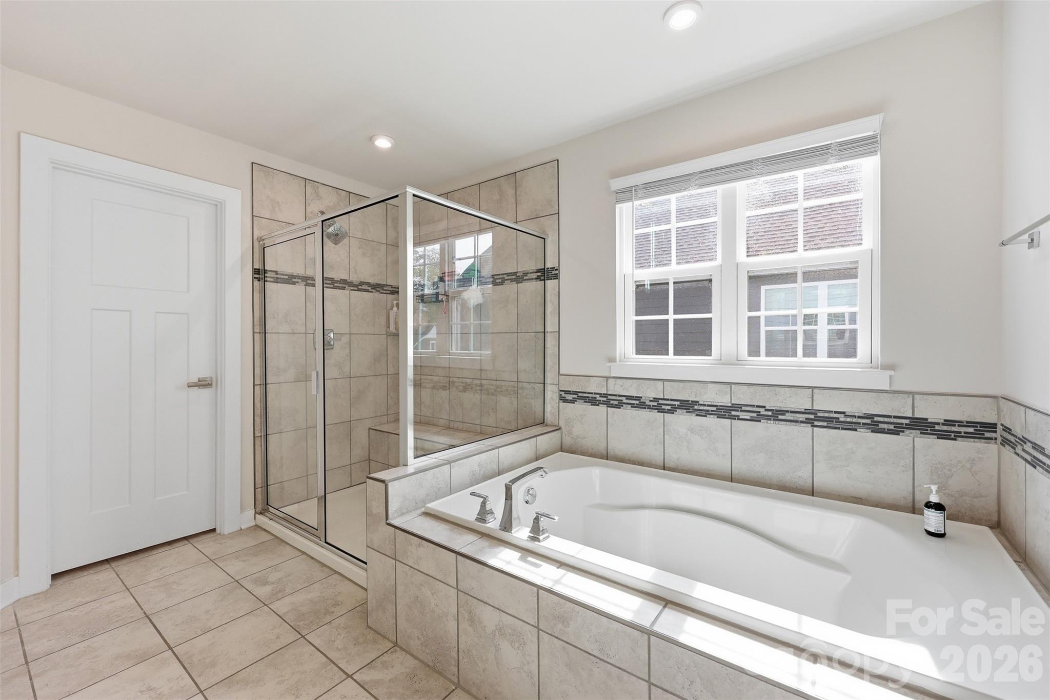 3057 Ballester Road Fort Mill, SC 29707 - Photo 22 of 48 a bathroom with a bathtub and a shower
