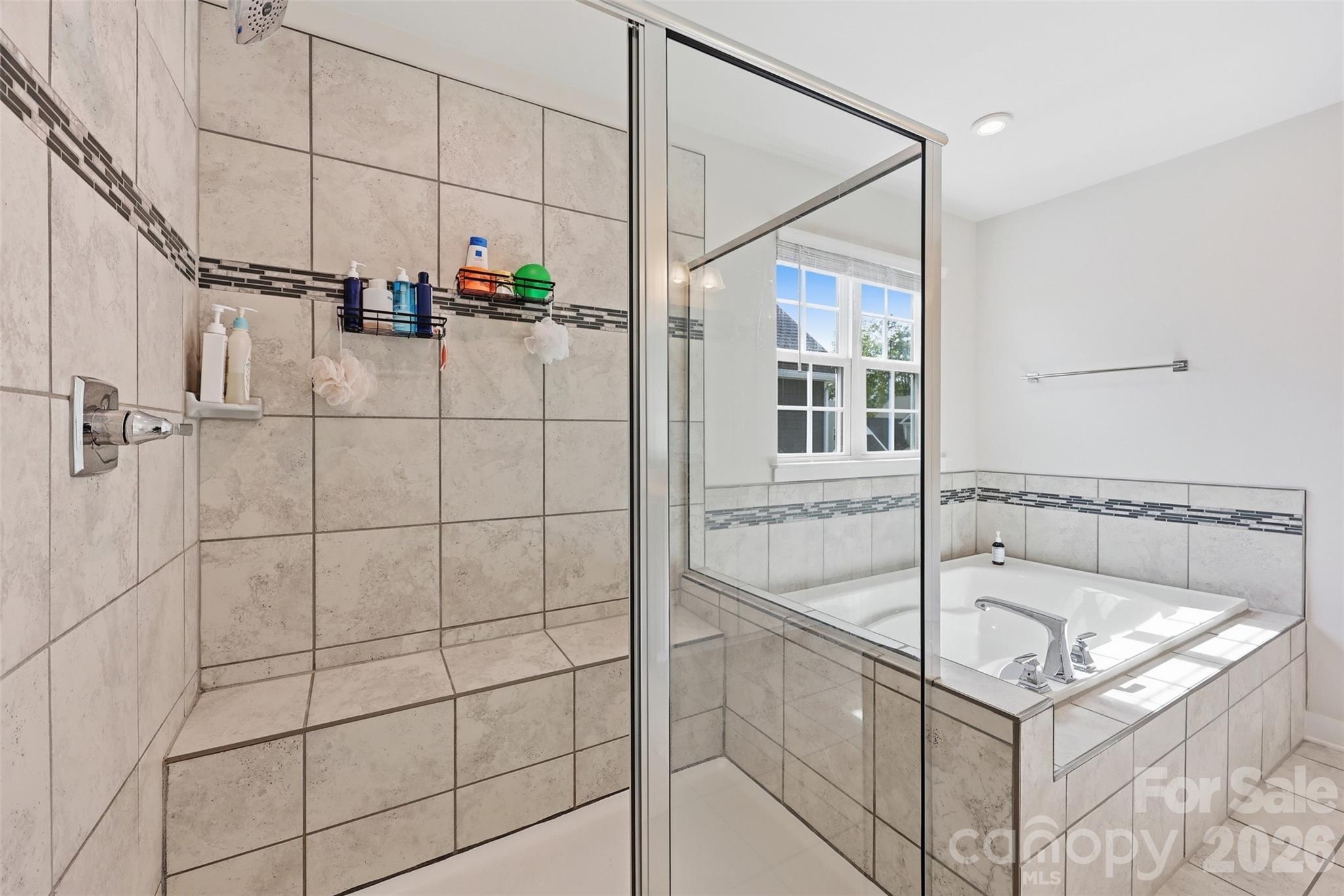 3057 Ballester Road Fort Mill, SC 29707 - Photo 24 of 48 a bathroom with a tub and shower