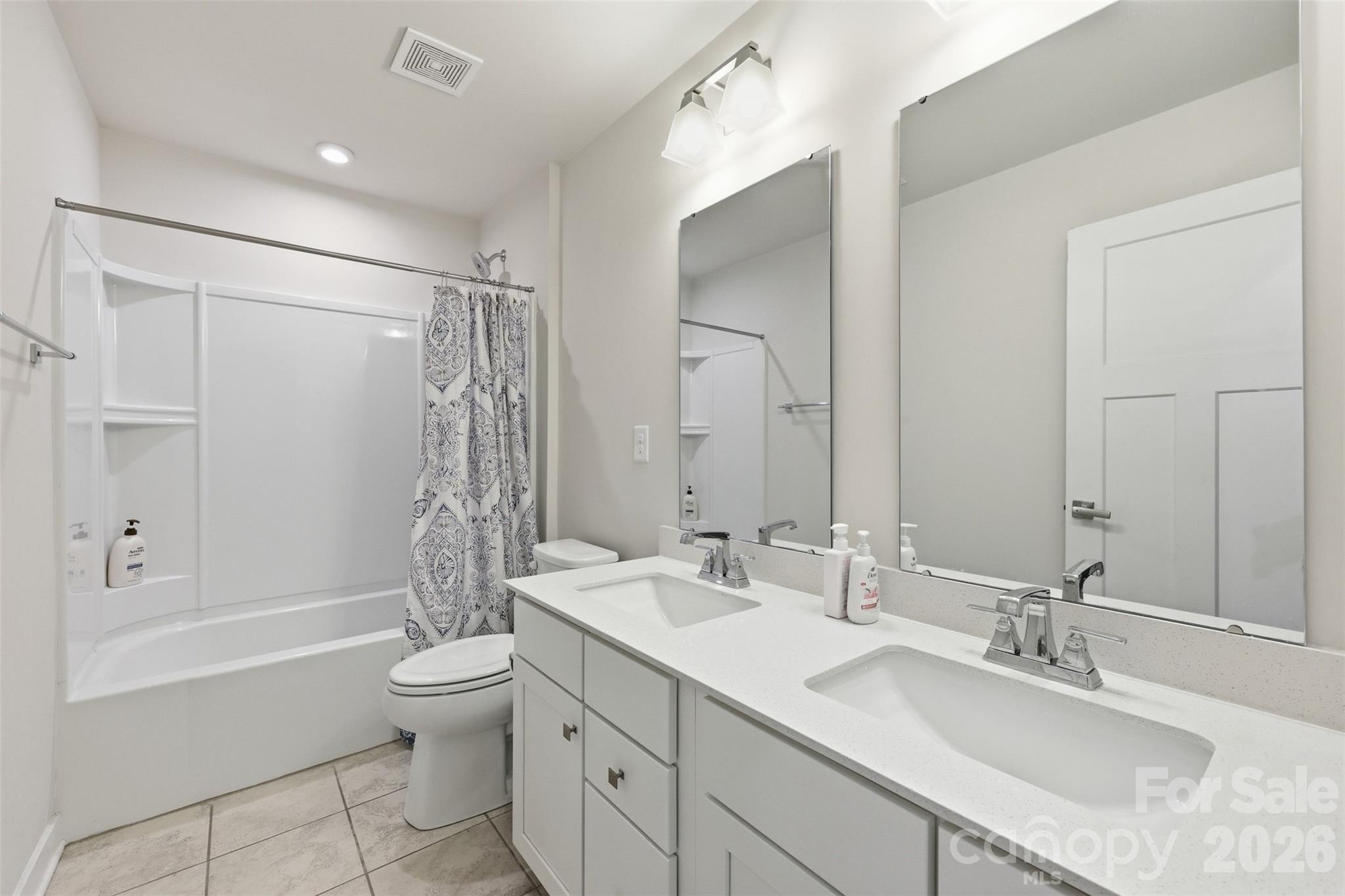 3057 Ballester Road Fort Mill, SC 29707 - Photo 29 of 48 a bathroom with a granite countertop sink a toilet and shower