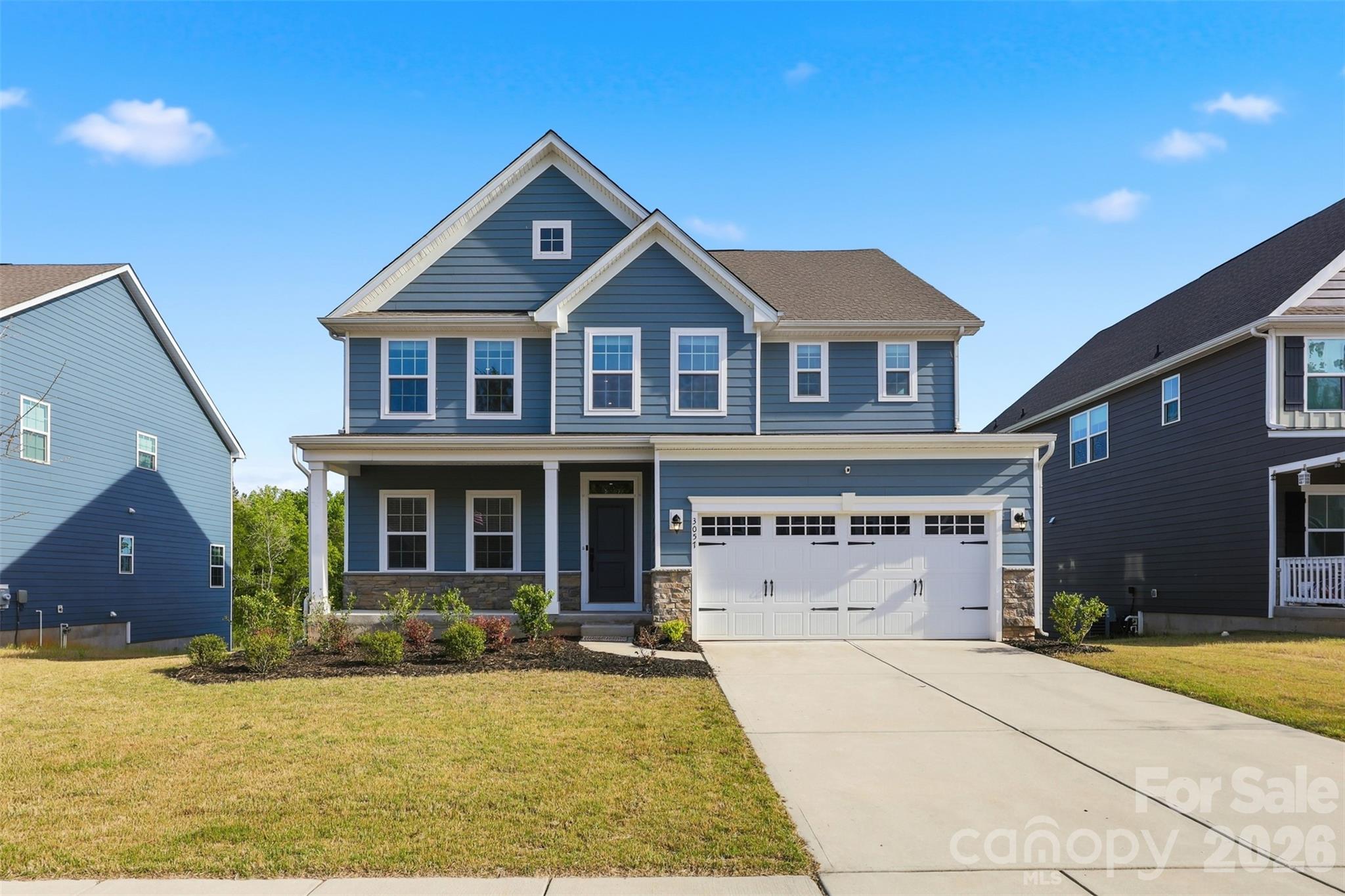 3057 Ballester Road Fort Mill, SC 29707 - Photo 3 of 48 a front view of a house with a yard
