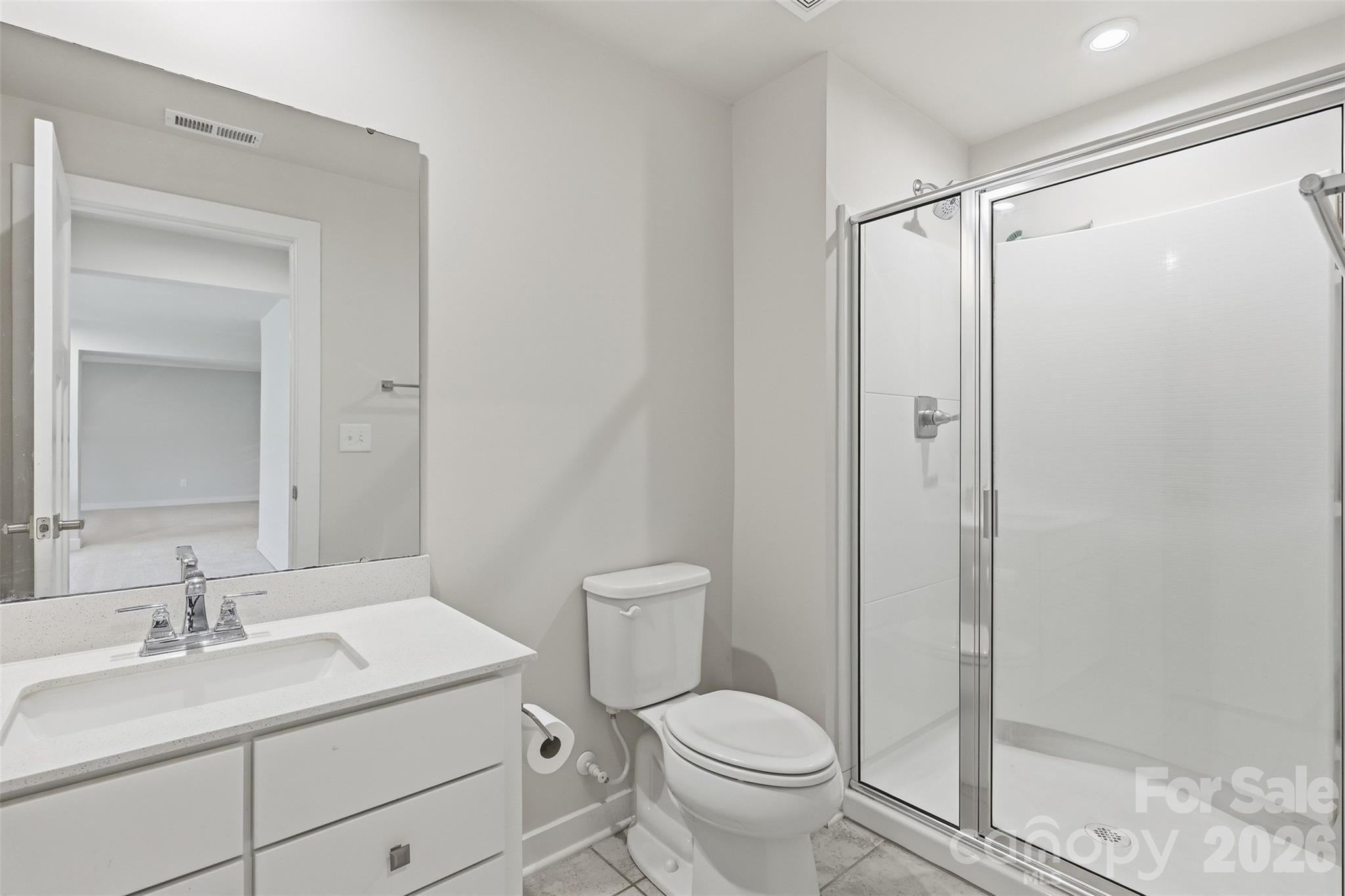 3057 Ballester Road Fort Mill, SC 29707 - Photo 31 of 48 a bathroom with a granite countertop sink toilet and shower
