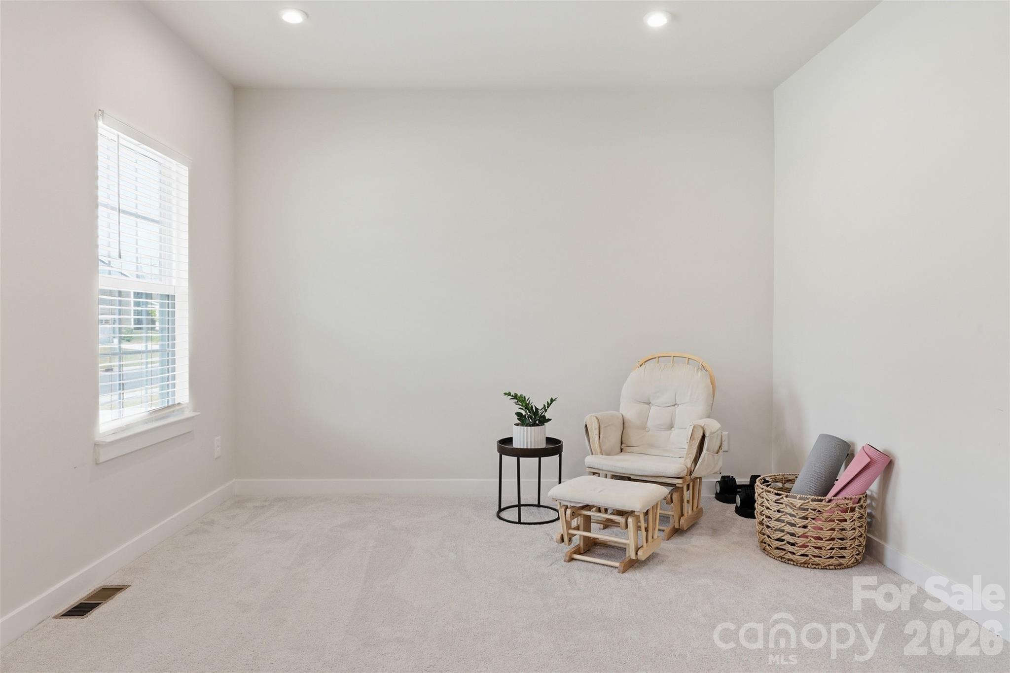 3057 Ballester Road Fort Mill, SC 29707 - Photo 5 of 48 a room with a table chair and a window
