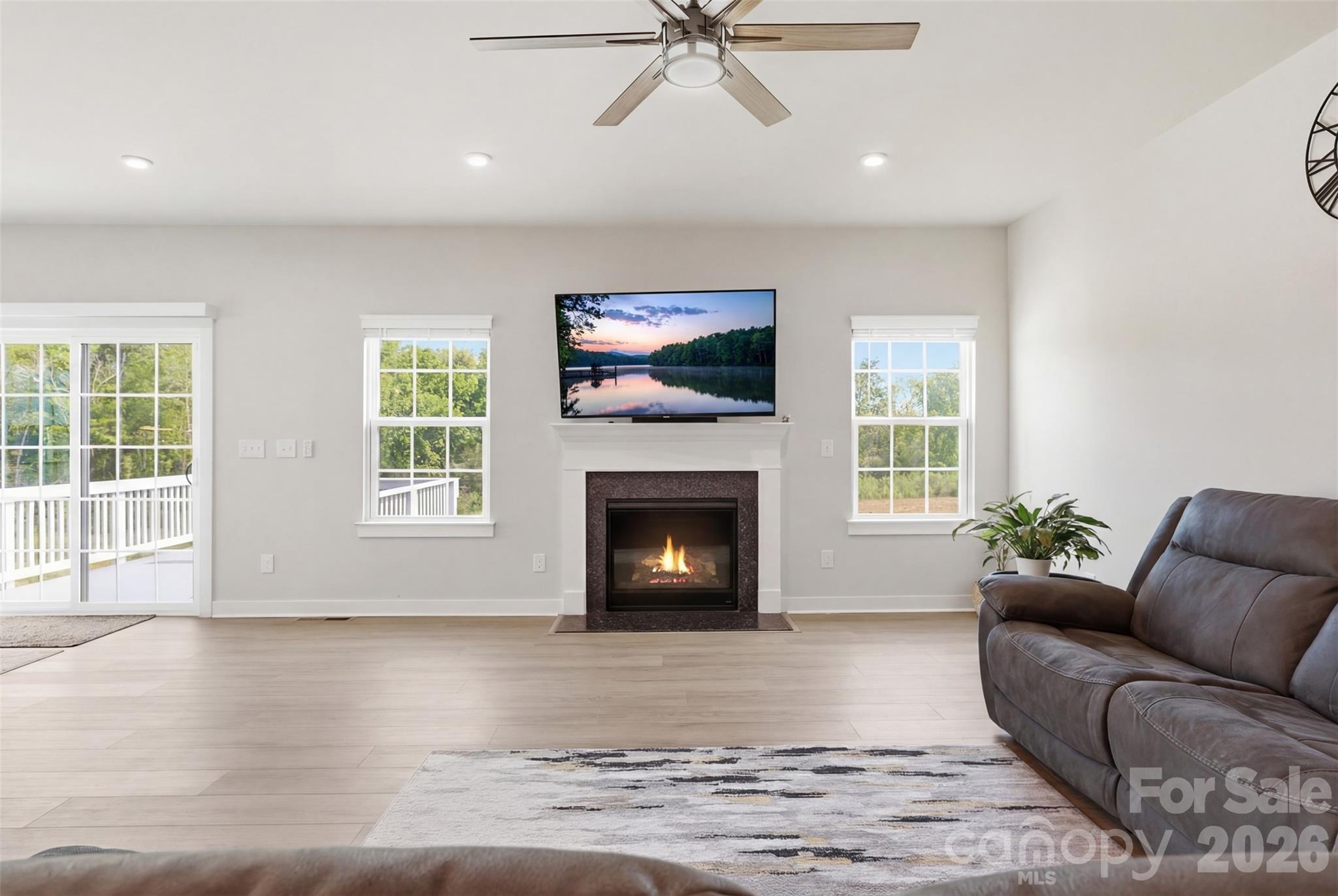 3057 Ballester Road Fort Mill, SC 29707 - Photo 7 of 48 a living room with furniture a fireplace and a flat screen tv