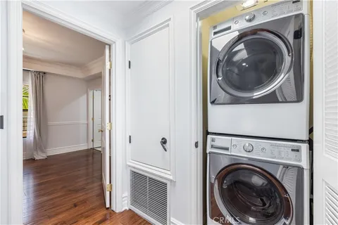 a view of a hallway with washer and dryer