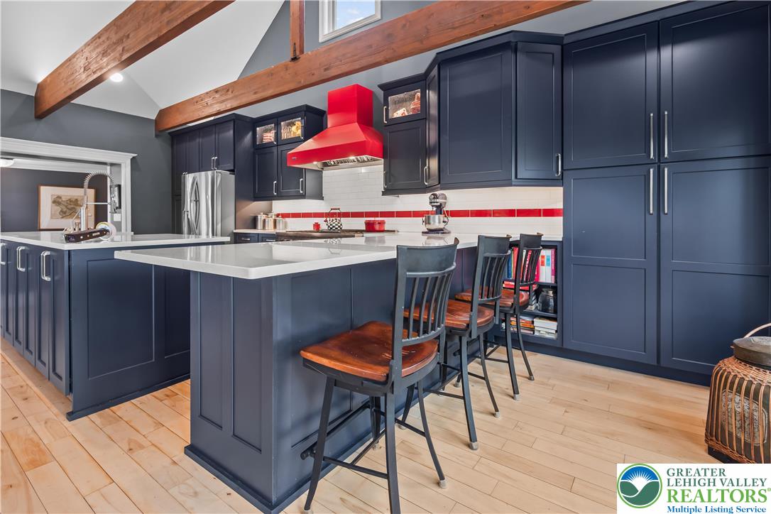 1072 5 Points Richmond Road Bangor, PA 18013 - Photo 21 of 66 a kitchen with stainless steel appliances a dining table chairs and wooden floor