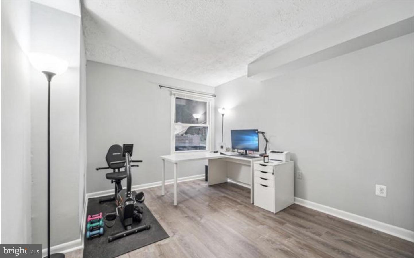 3841 St Barnabas Road, Unit T1 Suitland, MD 20746 - Photo 3 of 14 a view of a kitchen with workspace and wooden floor