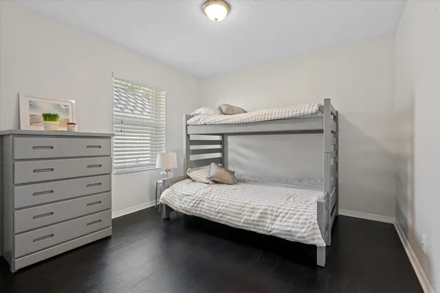a bedroom with a bed and cabinets
