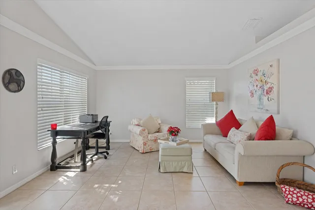 a living room with furniture and a window