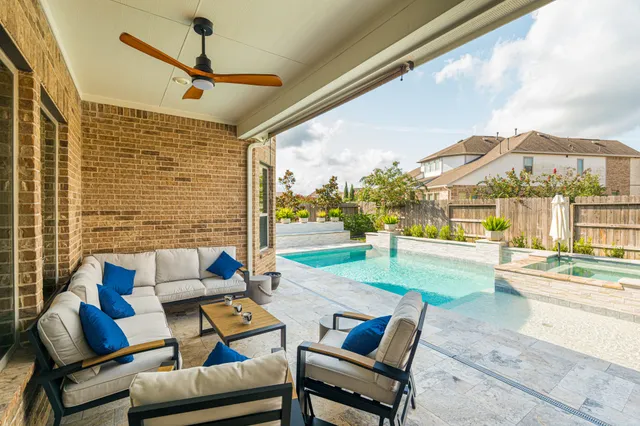 a outdoor space with patio the couches and pool view