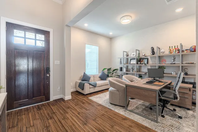 a workspace with furniture and window