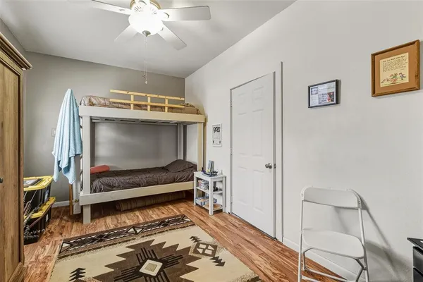 a bedroom with furniture and a window