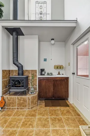 a view of kitchen with furniture and cabinets