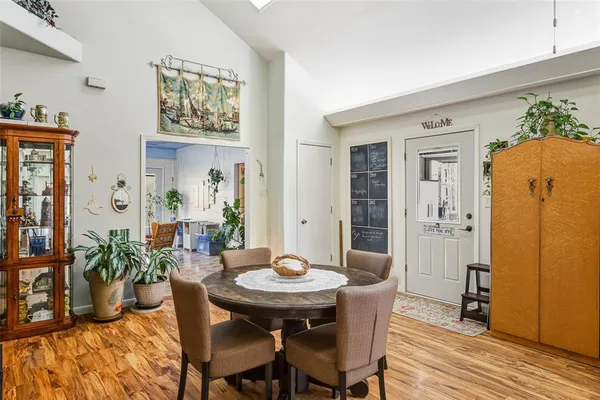 a view of a dining room with furniture and wooden floor
