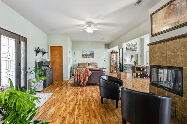 a living room with furniture and a large window