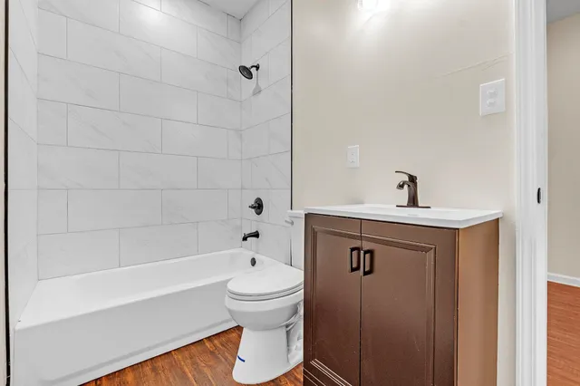 a view of entryway and hall with wooden floor