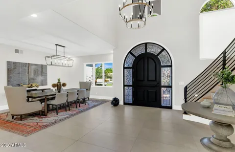 a kitchen with stainless steel appliances granite countertop a refrigerator and a stove