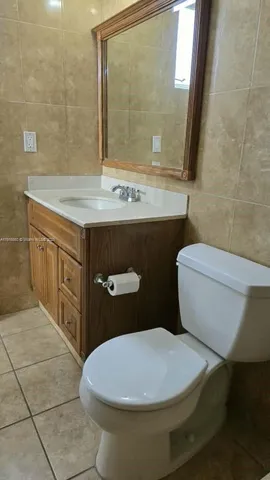 a stove top oven sitting inside of a kitchen