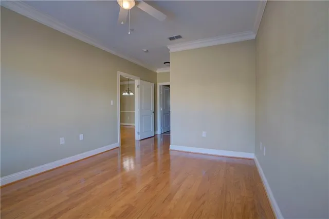 a view of storage and utility room with wooden floor