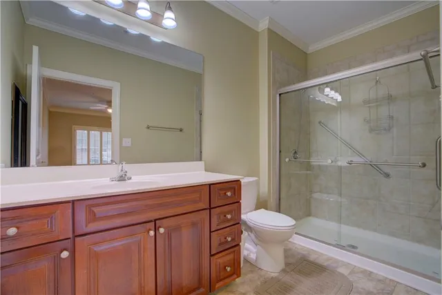 a view of a room with wooden floor and windows