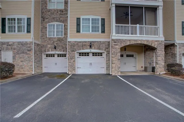 a front view of a house with a garage