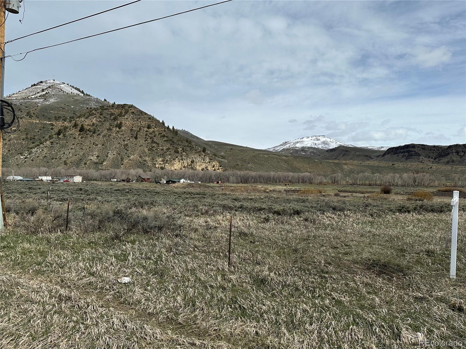 13-15 Block 5 Cedar Street Hot Sulphur Springs, CO 80451 - Photo 3 of 5 a view of a dry field with mountains in the background