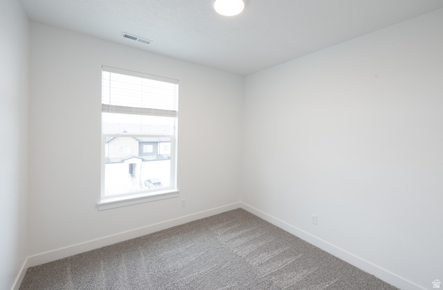 4653 South Alder Drive, Unit H302 Mapleton, UT 84664 - Photo 9 of 15 Carpeted spare room with baseboards