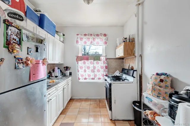 a kitchen with a refrigerator and a stove