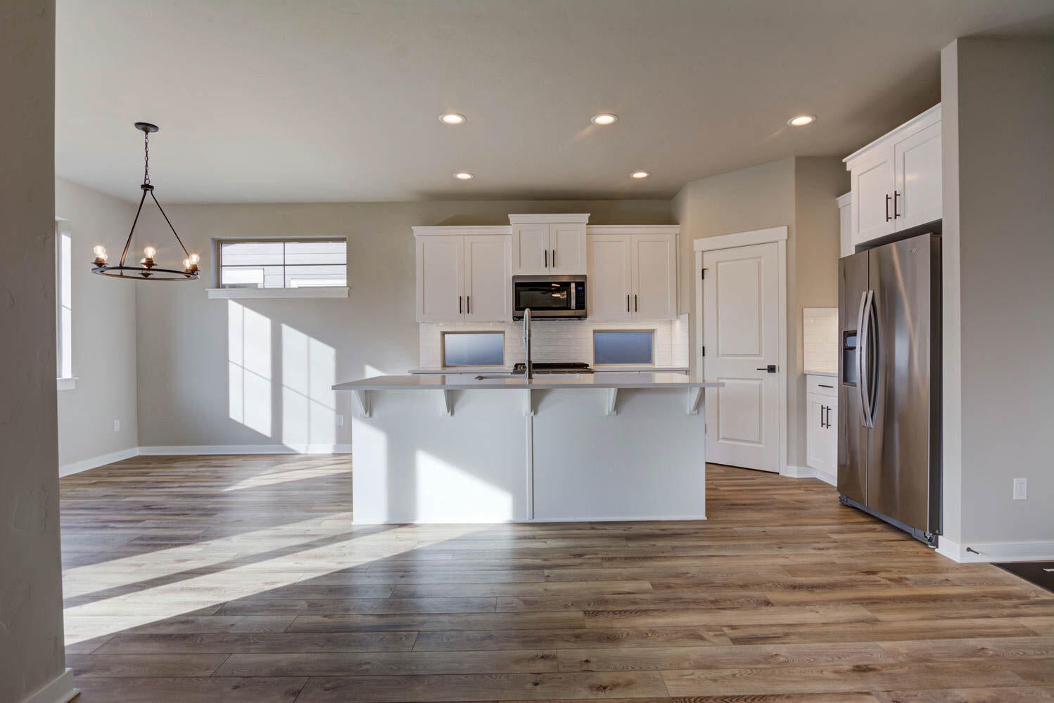 4652 Southwest 36th Street Redmond, OR 97756 - Photo 13 of 36 Kitchen and dining area. Greatroom. Example photo only. Some upgrades may be present. Specs and finishes vary. Refrigerator is not included.
