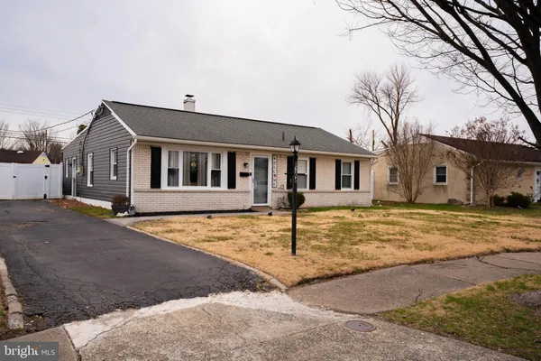 a front view of a house with yard
