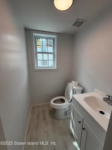 a view of bathroom with a sink and a toilet