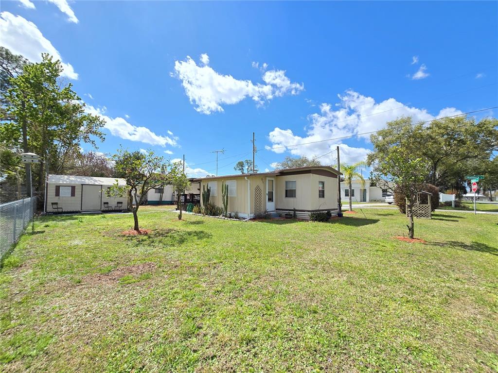 1621 Haddock Street St. Cloud, FL 34771 - Photo 11 of 46 a house view with a garden space