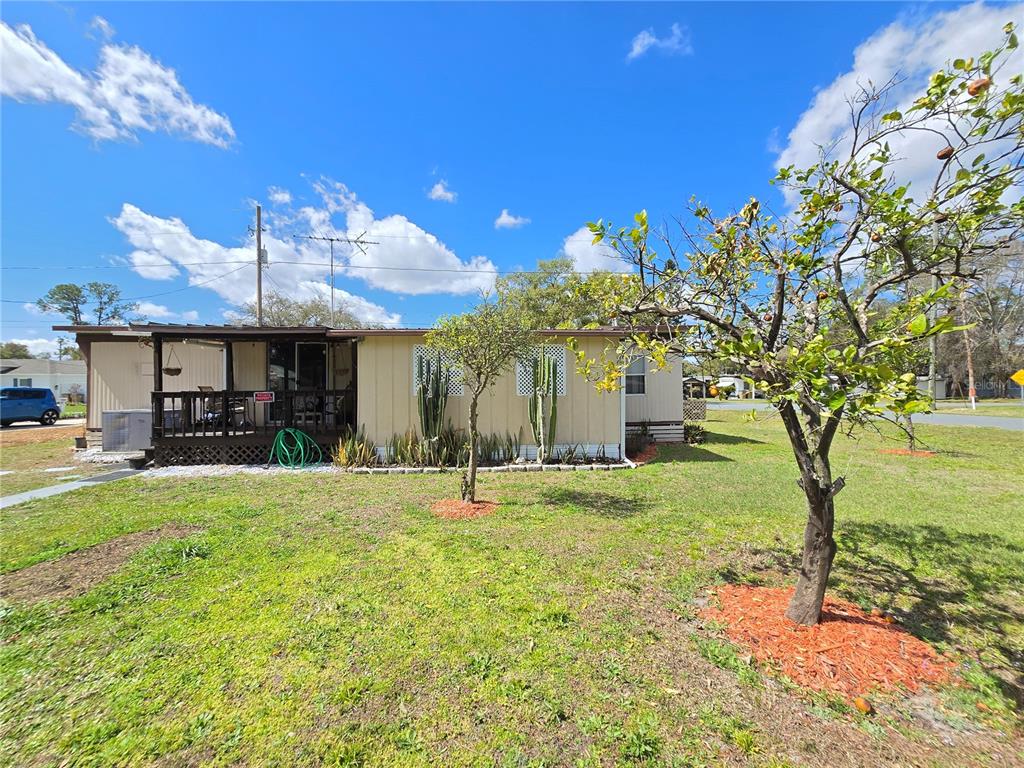 1621 Haddock Street St. Cloud, FL 34771 - Photo 12 of 46 a view of a house with a yard and sitting area