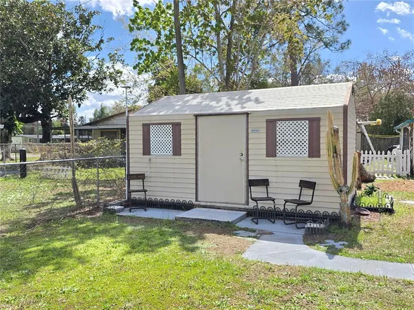 a view of a backyard with a sitting area