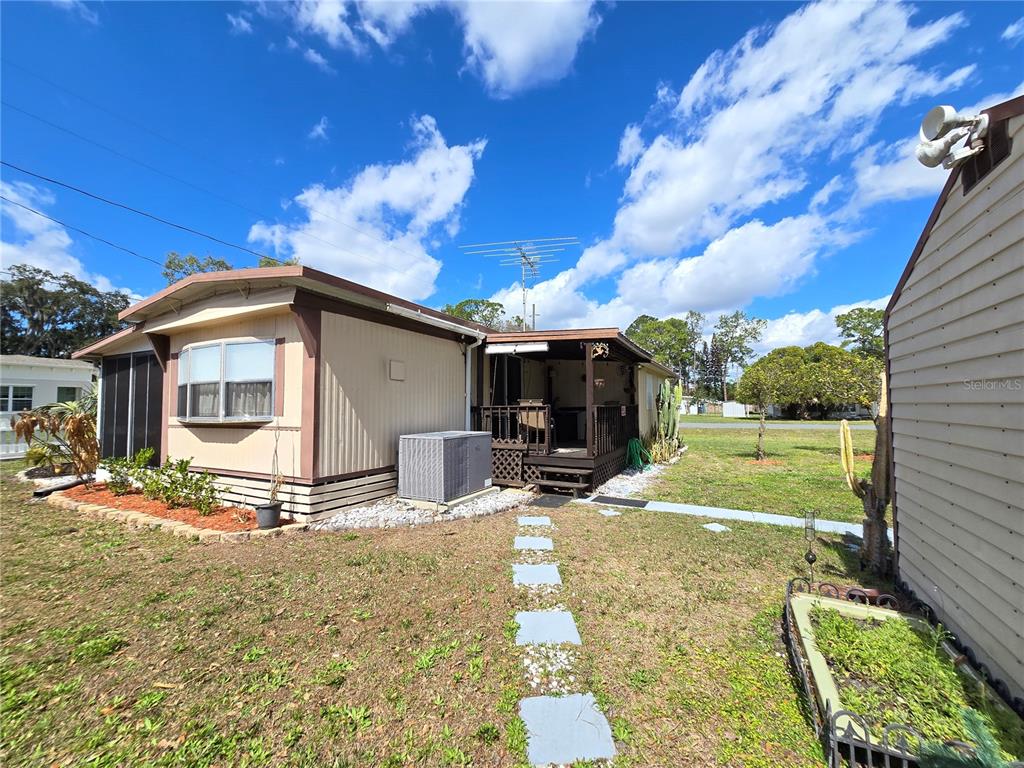 1621 Haddock Street St. Cloud, FL 34771 - Photo 17 of 46 a front view of a house with garden