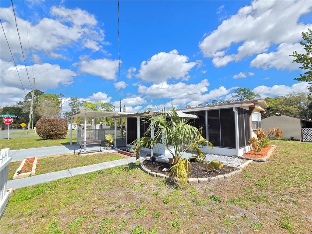 1621 Haddock Street St. Cloud, FL 34771 - Photo 18 of 46 a view of a house with a yard