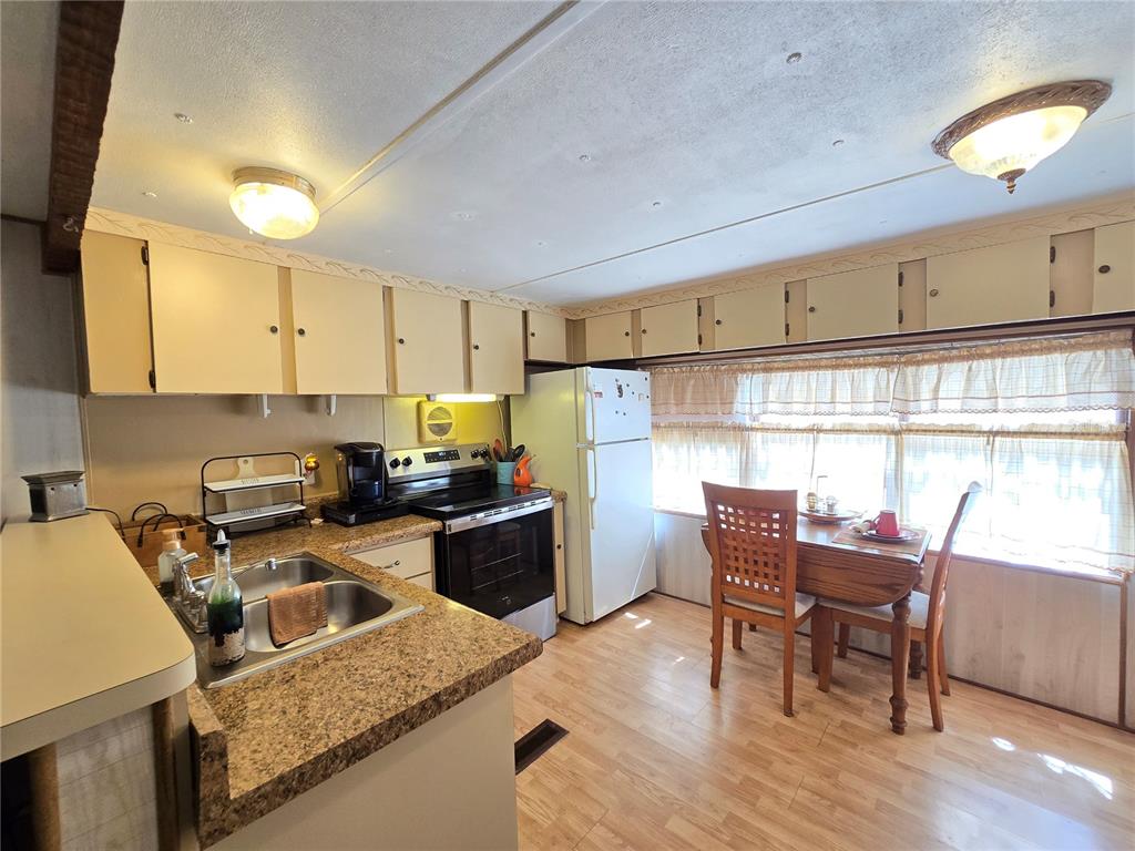 1621 Haddock Street St. Cloud, FL 34771 - Photo 29 of 46 a kitchen with a sink cabinets and window