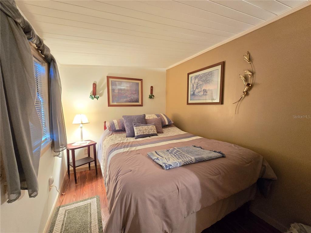 1621 Haddock Street St. Cloud, FL 34771 - Photo 37 of 46 a bedroom with bed and a window