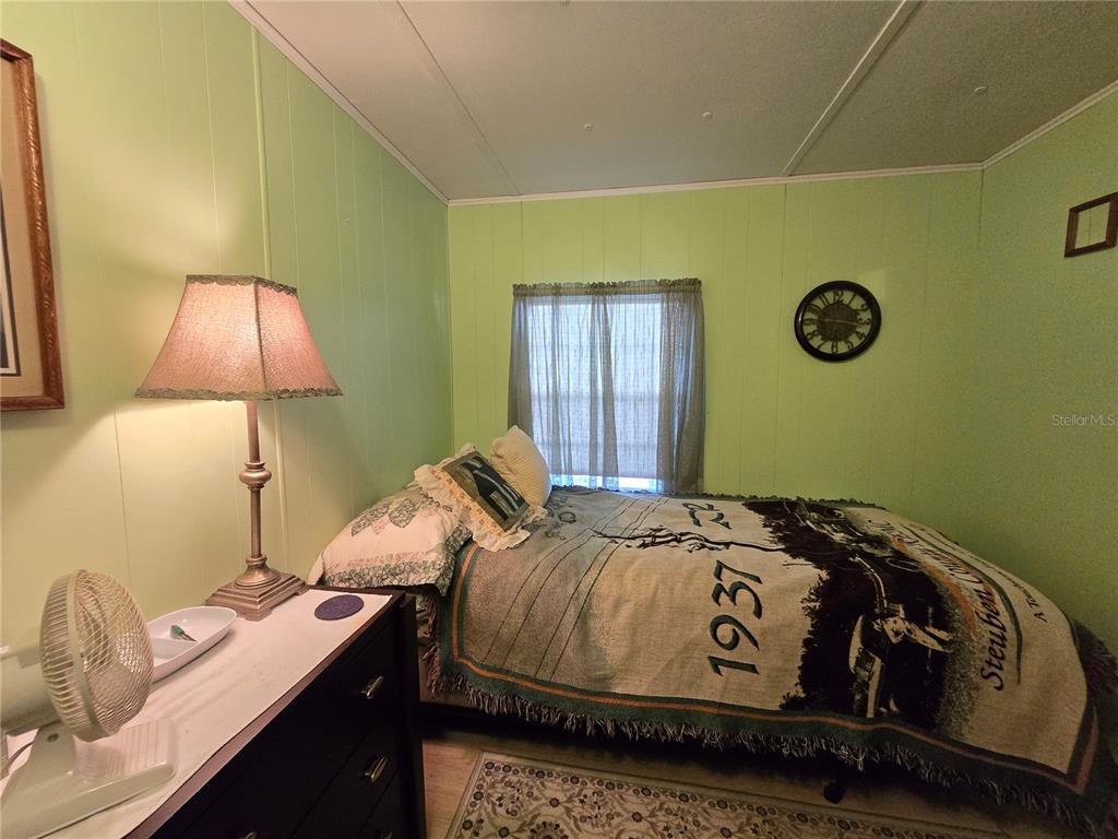 1621 Haddock Street St. Cloud, FL 34771 - Photo 39 of 46 a bedroom with a bed and a window