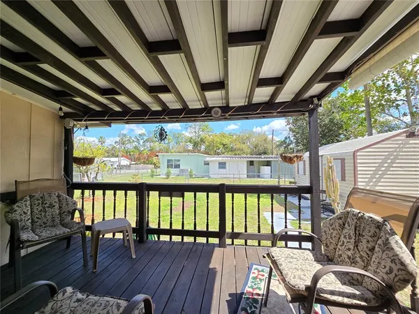 a view of a porch with furniture and a porch