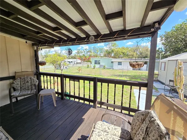 a view of a backyard with a sitting area